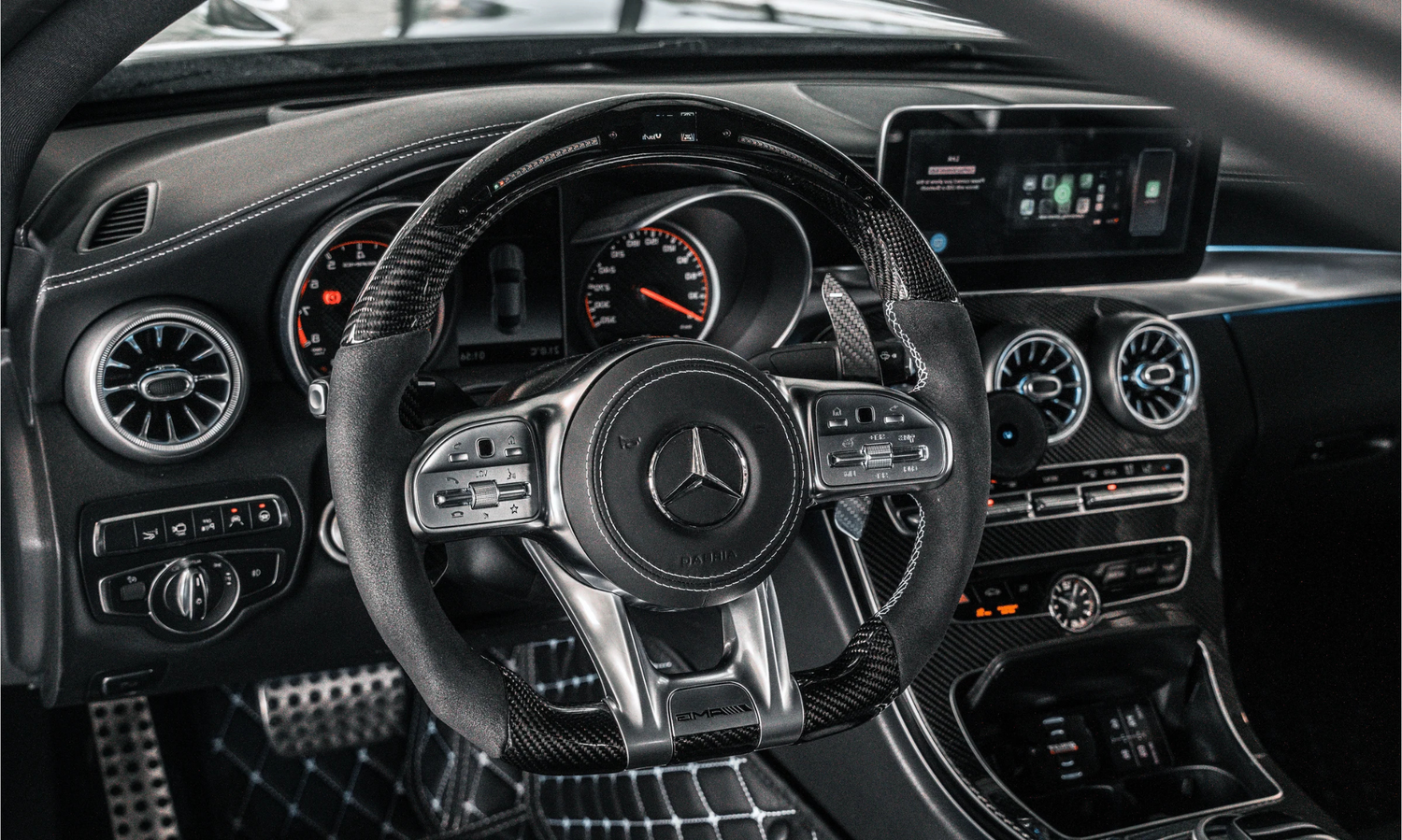 Custom Mercedes AMG steering wheel in carbon fibre and Alcantara, fitted in a C-Class